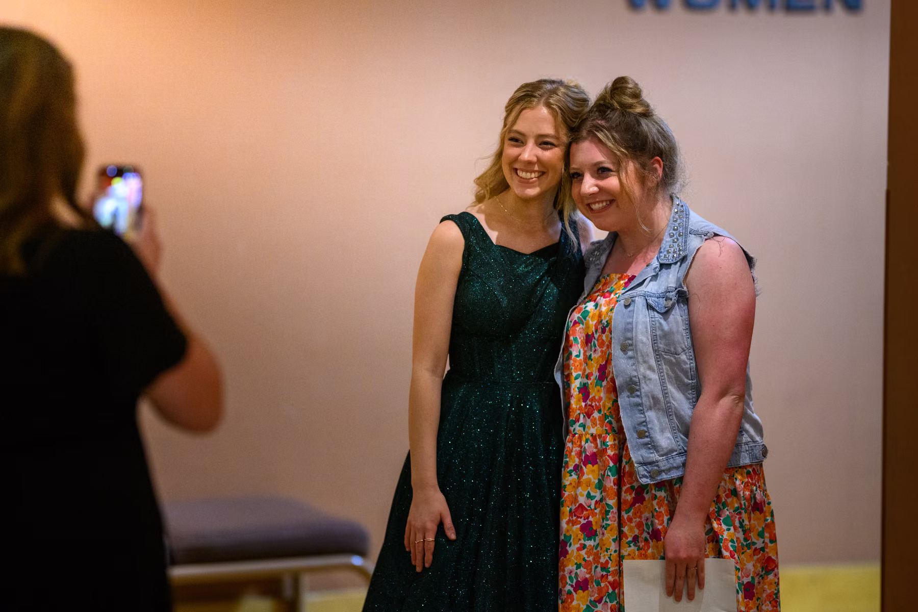Alyssa posing for a photograph with a guest after the recital.